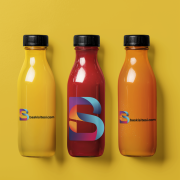 ai-created-mockup-featuring-three-juice-glass-bottles-placed-on-a-colorful-background-m40413