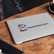 laptop-cover-mockup-of-a-computer-placed-on-a-wooden-table-next-to-a-coffee-2292-el1